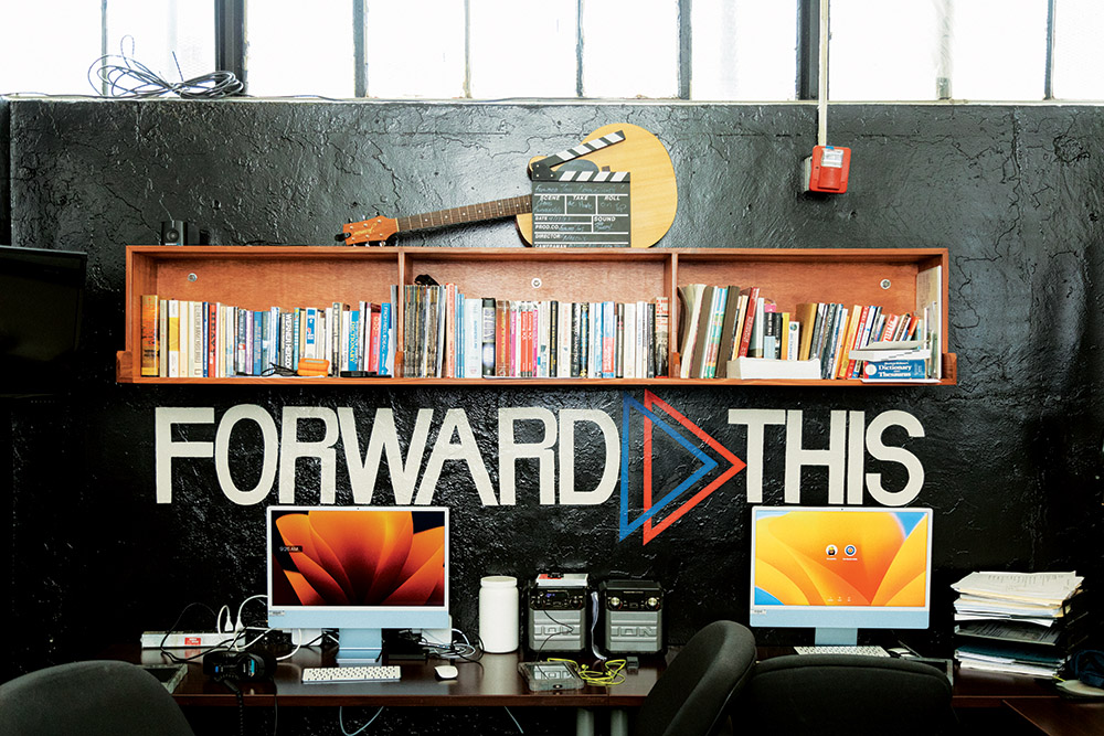 The ForwardThis office has four Macs, some lockers with cameras and lenses and a shelf of filmmaking books, including Story by Robert McKee.