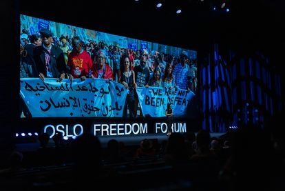 Sana Seif, on June 14 in Oslo. Behind her, an image of a demonstration in which she demanded the freedom of her brother Alaa.