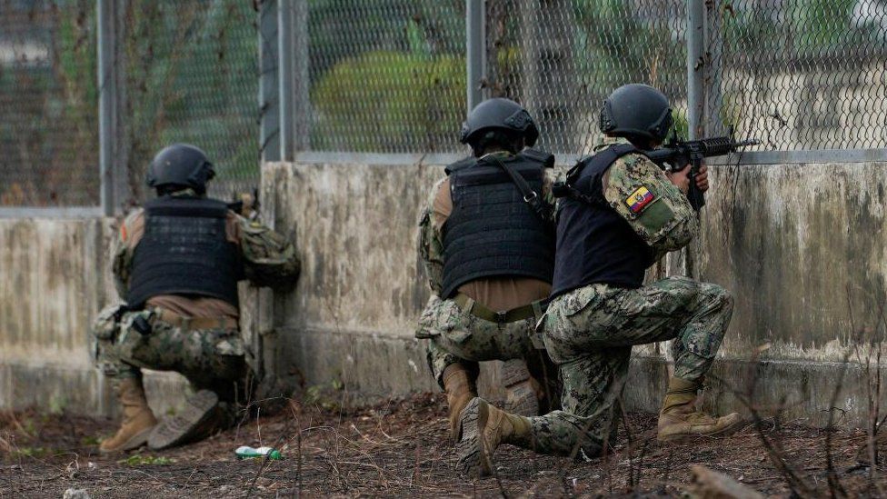 Soldiers guard a gate after several inmates were killed in fights between gangs, in Guayaquil, Ecuador November 2, 2022.