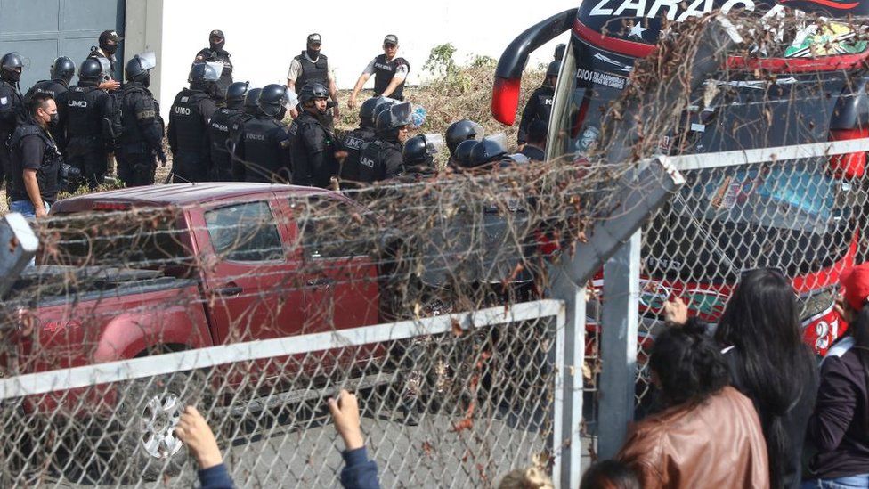 National police officers transfer inmates from the Guayas 1 prison in response to an attempted prison riot in Guayaquil, Ecuador, on November 3, 2022.