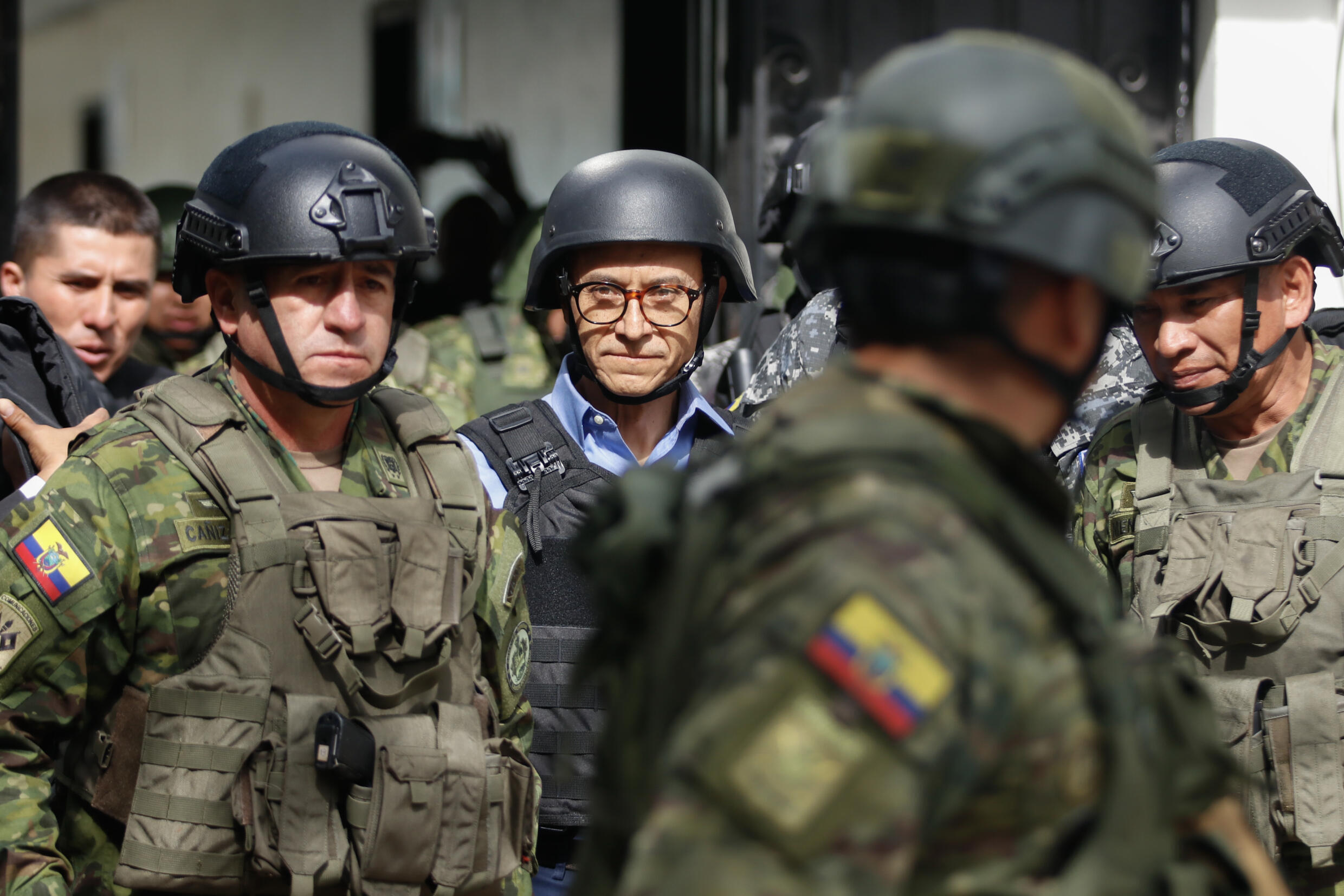 Ecuadoran presidential candidate Christian Zurita goes to vote in a bulletproof vest and helmet