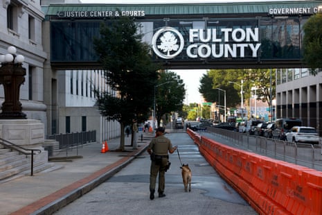 A Fulton County Sheriff K-9 officer secures the area around the Fulton County Courthouse in Atlanta, Georgia.