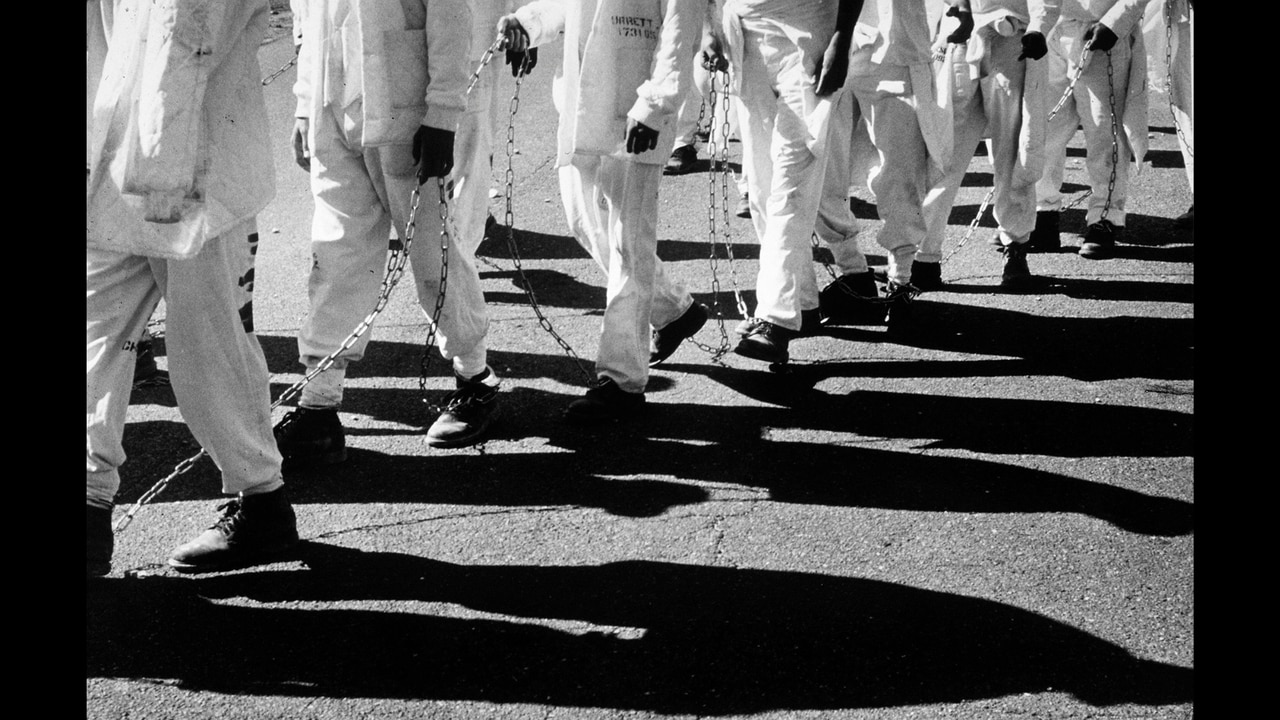 Legs of Chain Gang Workers Passing