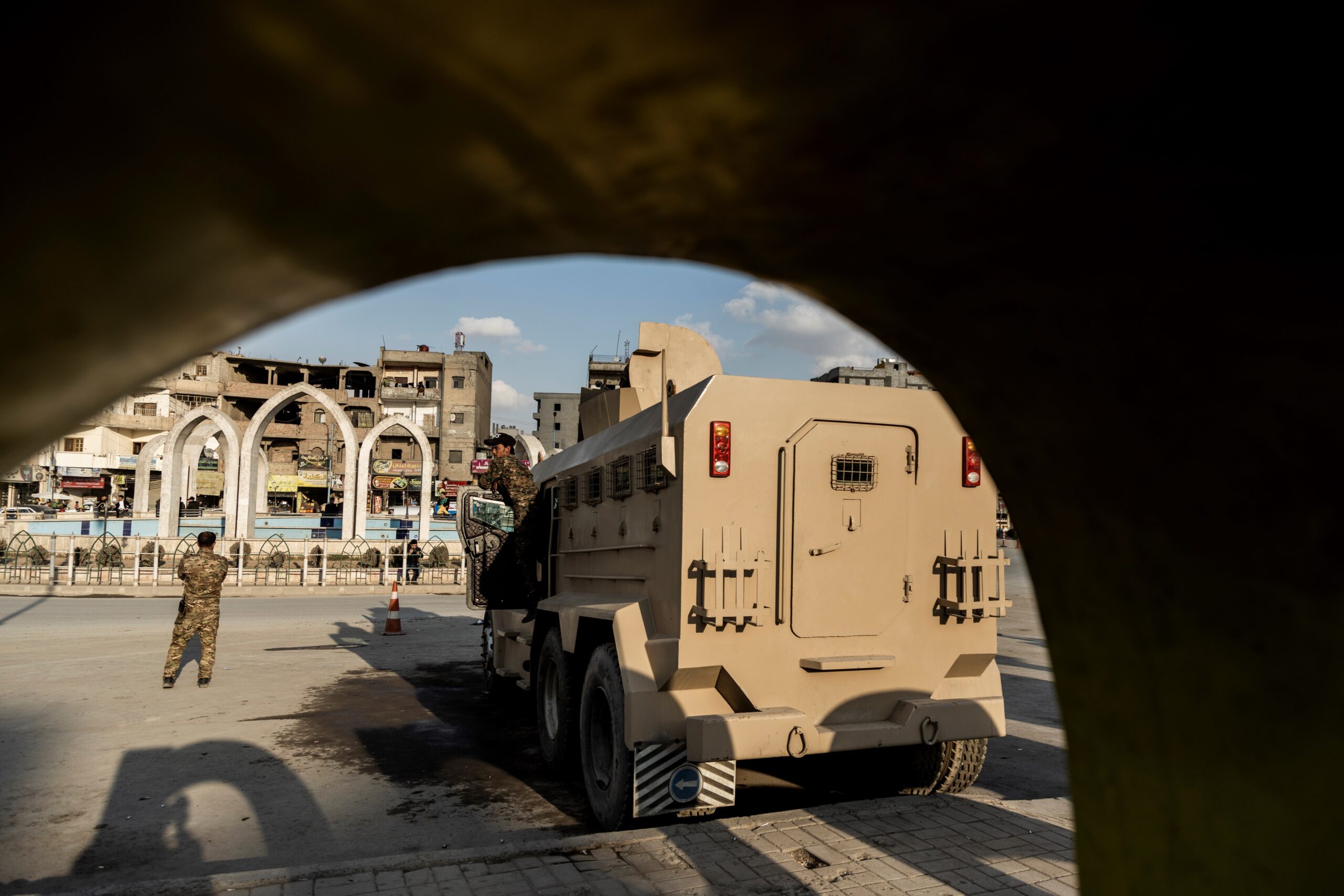 US-backed Syrian Democratic Forces (SDF) fighters stand guard at Al Naeem Square, in Raqqa, Syria, February 7, 2022 (AP)