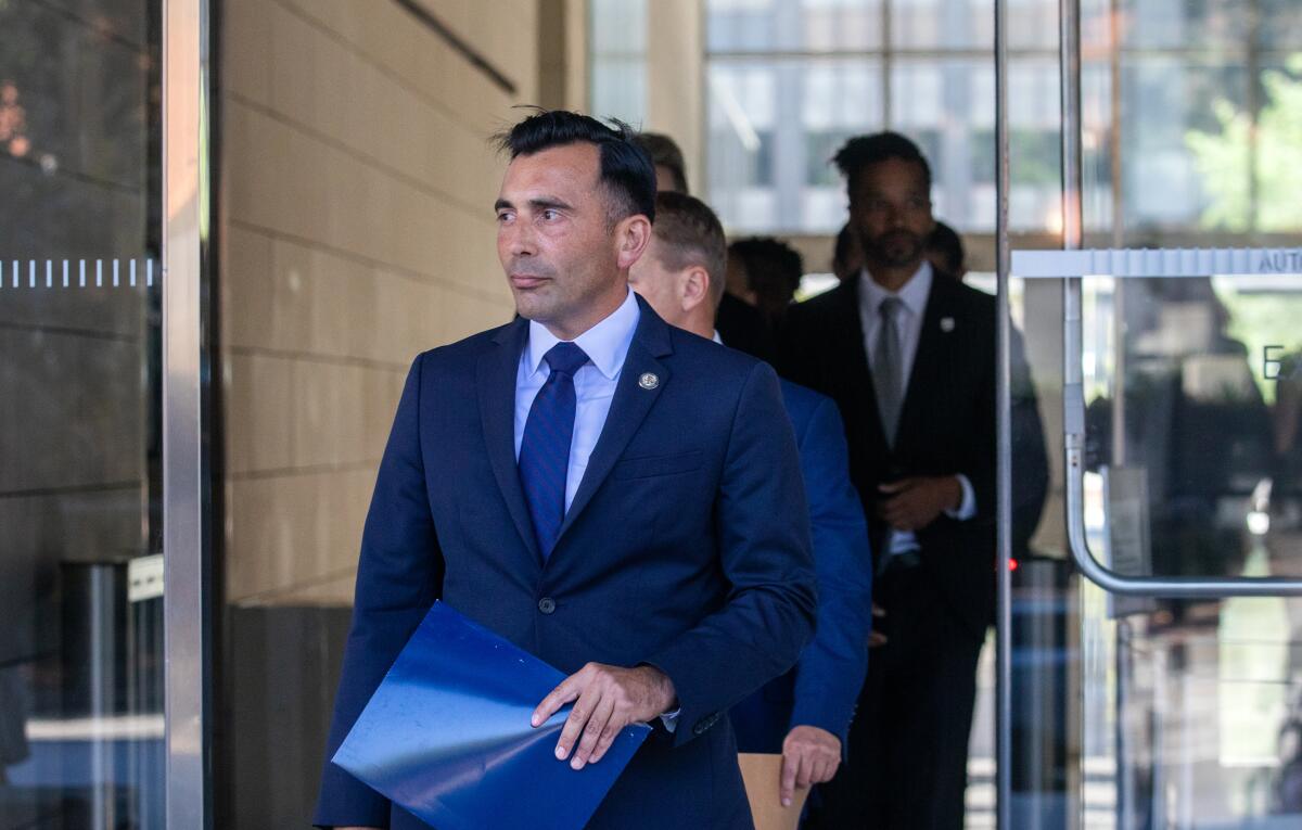 U.S Atty. E. Martin Estrada walks outside the federal courthouse in downtown L.A. on Aug. 28, 2023.