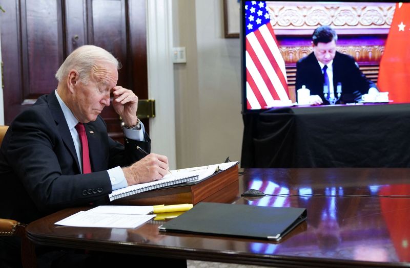 U.S. President Joe Biden gestures as he meets with China's President Xi Jinping during a virtual summit from the Roosevelt Room of the White House in Washington on Nov. 15, 2021.