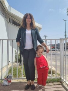 Sana' Salameh (left), wife of Palestinian prisoner Walid Daqqah, and their daughter Milad (right), before a visit of Daqqah in prison.