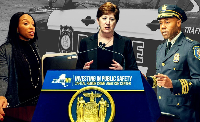 CCRB chair Nairobi Vives, Mayor Kathy Sheehan, and Police Chief Eric Hawkins against a police car