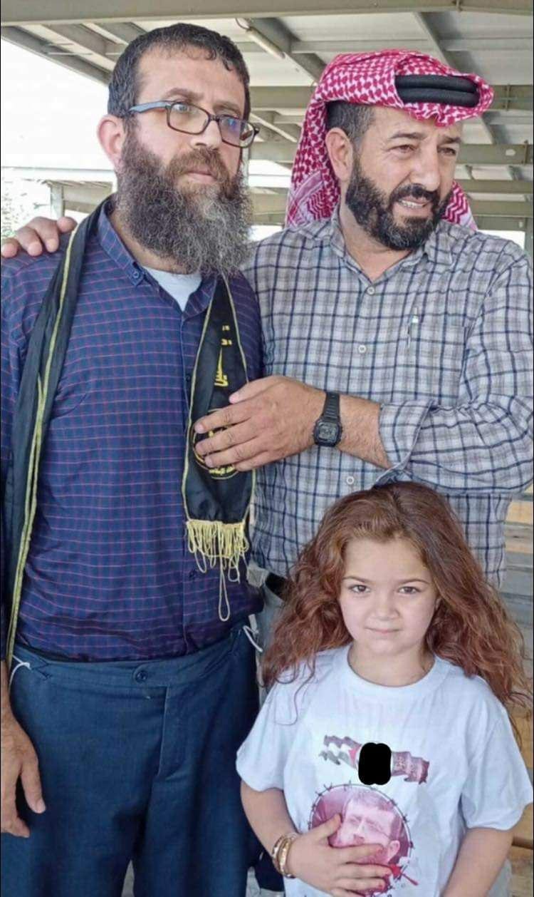 Khader Adnan and Maher al Akhras with Maher and Taghreed's daughter Tuqa.