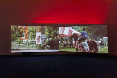 Mohamed Bourouissa, Horse Day (2014–2015). Video diptych (colour, sound). 13 min, 32 sec. Exhibition view: HARa!!!!!!hAaaRAAAAA!!!!!hHAaA!!!, Goldsmiths CCA, London (21 May–1 August 2021). © Mohamed Bourouissa, Adagp, Paris, 2023.