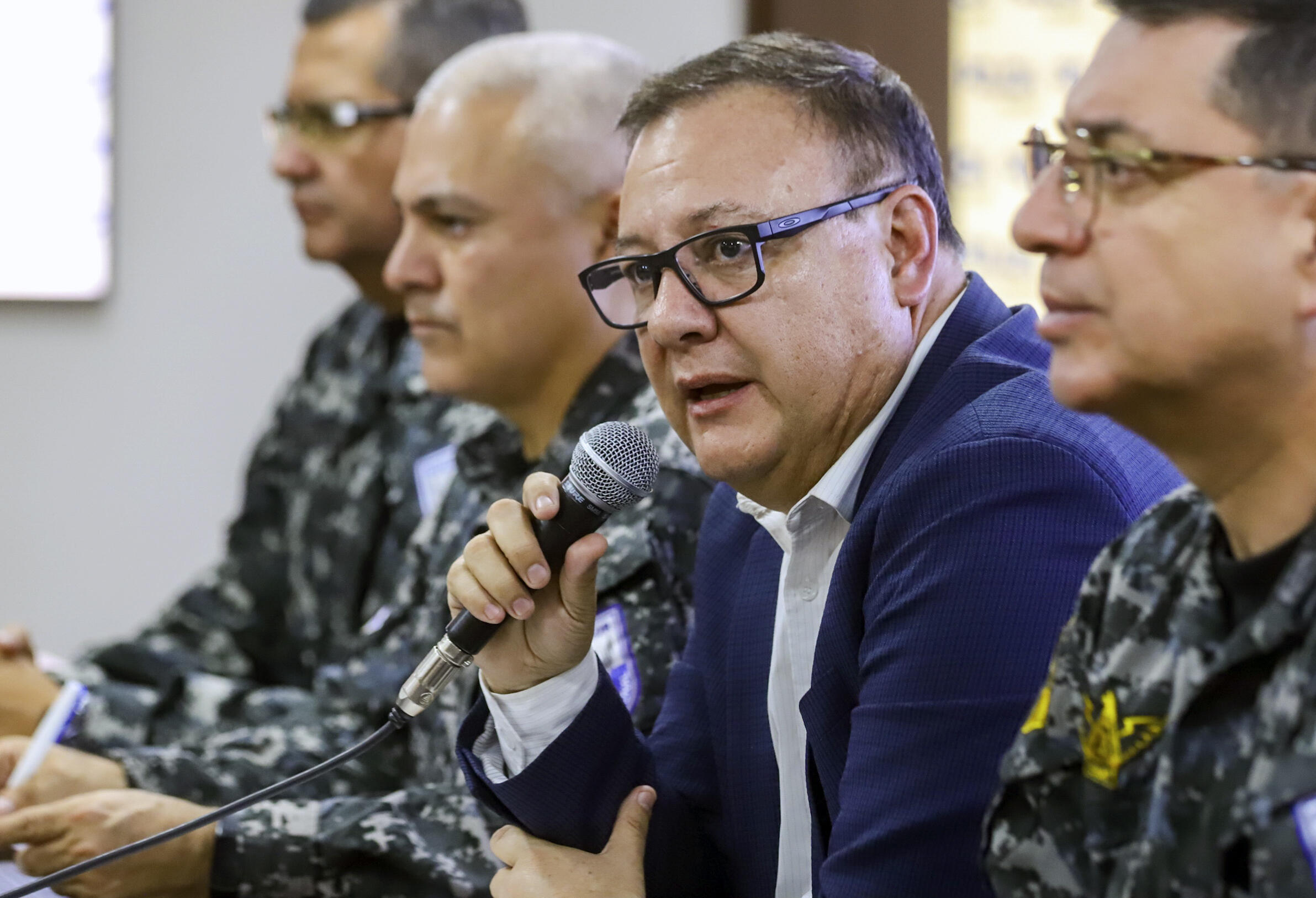 Ecuador's Interior Minister Juan Zapata, seen in a handout photo by the ministry, addresses reporters on August 31, 2023 after a series of car bombs and grenade attacks rocked the capital Quito