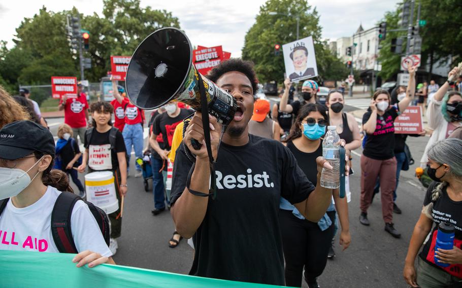 Kevin Cramer Jr. leads a chant during a protest march near the Supreme Court in June 2022. 