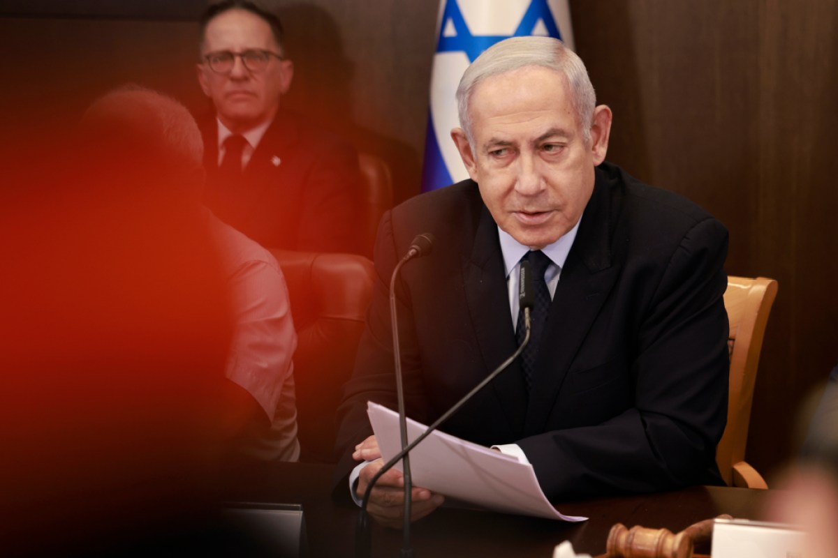 Israeli Prime Minister Benjamin Netanyahu, left, chairs a weekly cabinet meeting at his office in Jerusalem Sunday, Aug. 27, 2023 (Menahem Kahana/Pool Photo via AP)