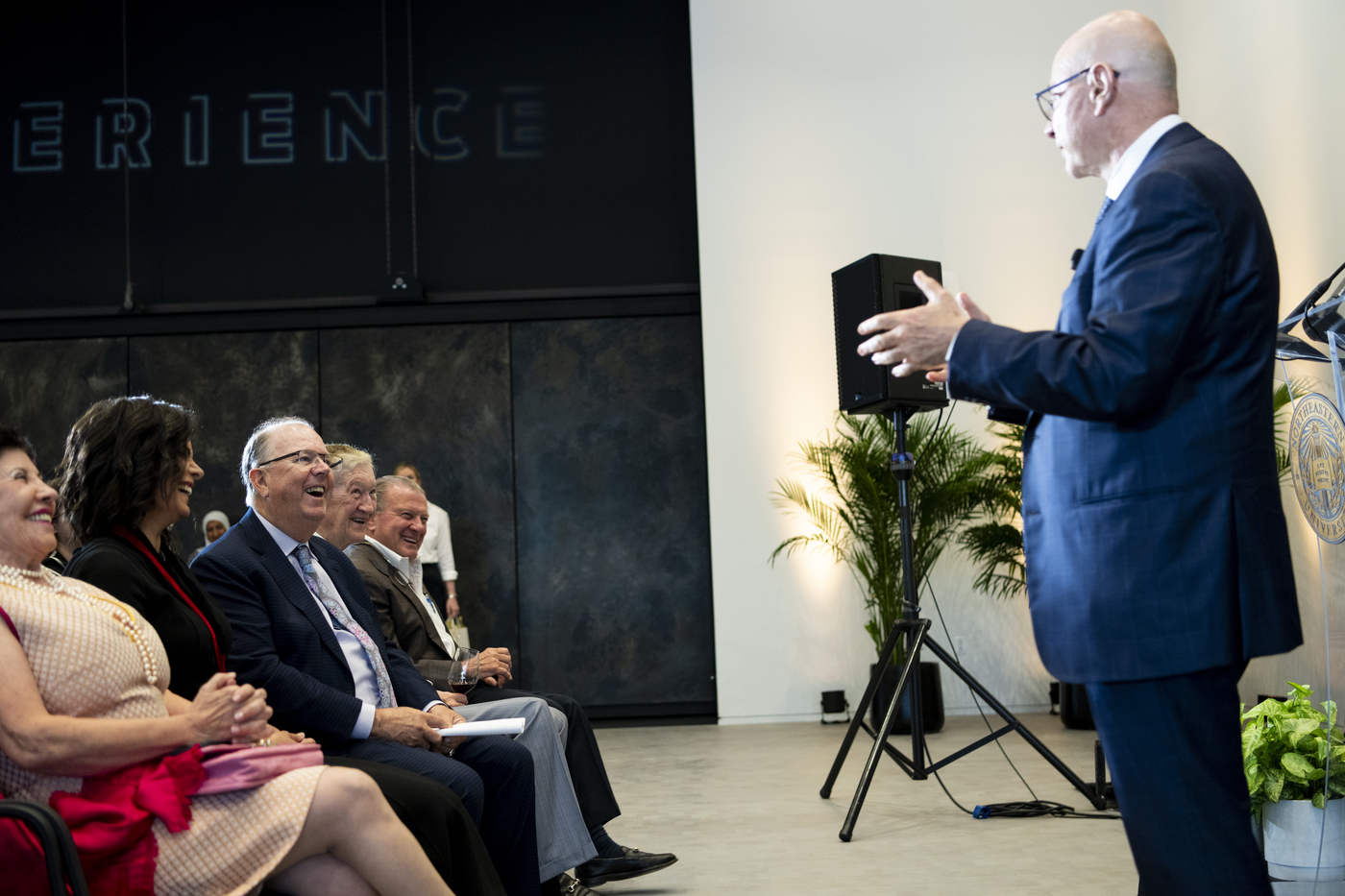 President Joseph E. Aoun speaks on a stage to an audience.