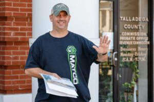 Shannon Barker talks outside the Talladega County motor vehicle registration office after registering a vehicle on Thursday, Aug. 31, 2023 in Talladega, Alabama