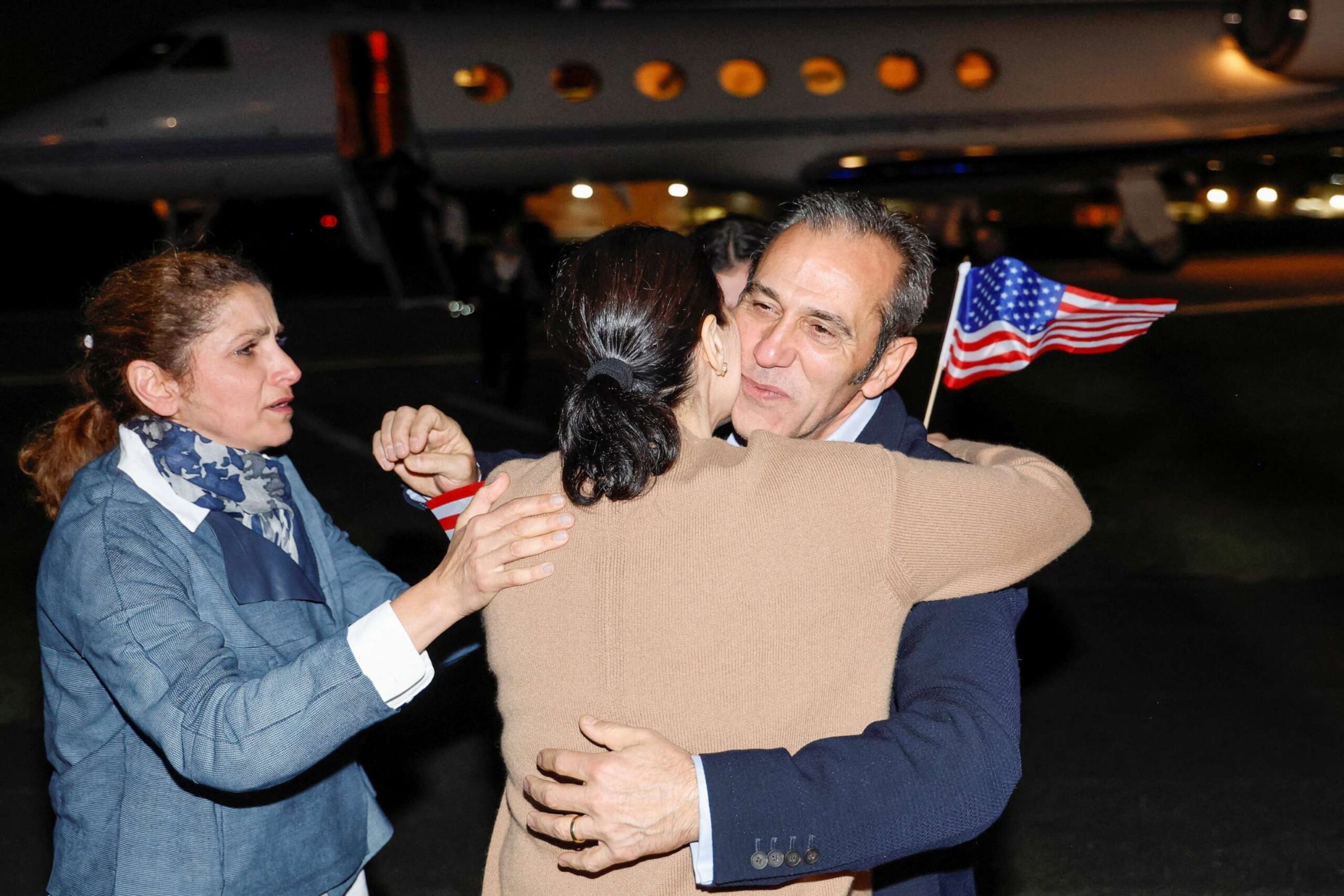 PHOTO: Family members embrace freed American Emad Shargi after he and four fellow detainees were released in a prisoner swap deal between U.S and Iran, and arrived at Davison Army Airfield at Fort Belvoir, Va., Sept. 19, 2023.