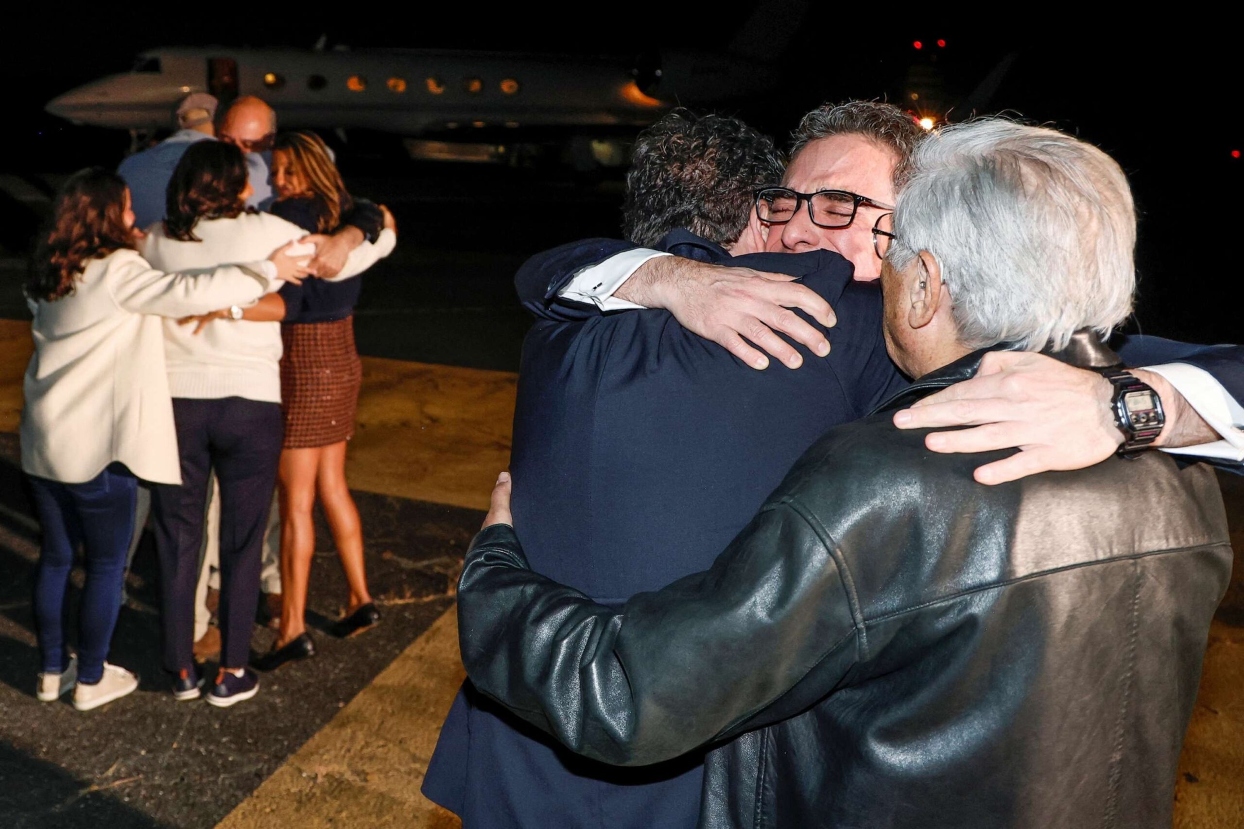 PHOTO: Family members embrace freed Americans Siamak Namazi, Morad Tahbaz and Emad Shargi as well as two returnees whose names have not yet been released by the U.S. government at Davison Army Airfield at Fort Belvoir, Va., Sept. 19, 2023.