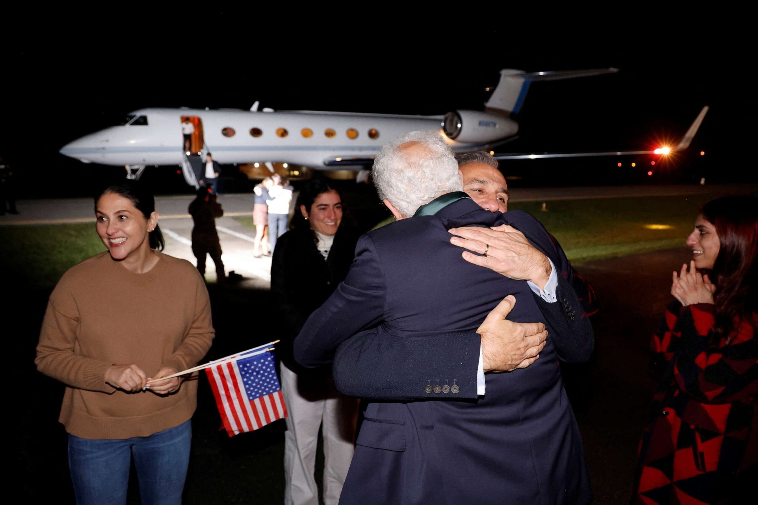 PHOTO: Family members embrace freed Americans Siamak Namazi, Morad Tahbaz and Emad Shargi as well as two returnees whose names have not yet been released by the U.S. government at Fort Belvoir, Va., Sept. 19, 2023.