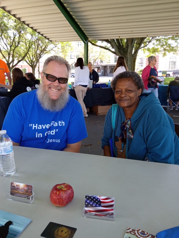 Oneida Baptist Church Pastor Terry Brown, Linda Moody in Higinbotham Park. (Roger Seibert - MediaNews Group)