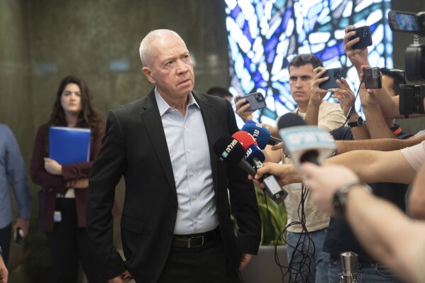 FILE - Israeli Minister of Defense Yoav Gallant talks to reporters ahead of the weekly cabinet meeting in Jerusalem, on Sept. 10, 2023. Israel accused Iran on Monday Sept. 11, 2023 of building an airport in southern Lebanon to be used as a launchpad for attacks against Israelis across the border, signaling a possible escalation in tensions between the regional foes. (AP Photo/Ohad Zwigenberg, Pool, File)