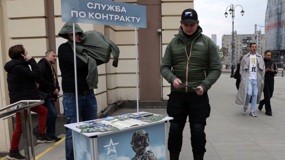 Recruiters in Moscow at a stall