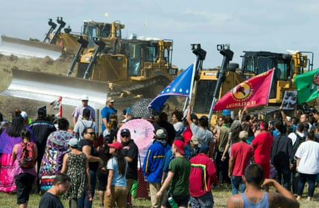 Members of the Standing Rock Sioux tribe and their supporters confront bulldozers working on the the Dakota Access pipeline in September 2016