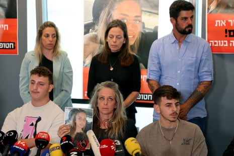 Keren Shem (C), the mother of French-Israeli woman Mia Shem, held hostage by Hamas militants in Gaza, speaks to the press in Tel Aviv