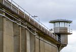 A wall and guard tower at Oregon State Penitentiary prison.