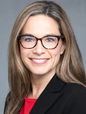 smiling woman in suit