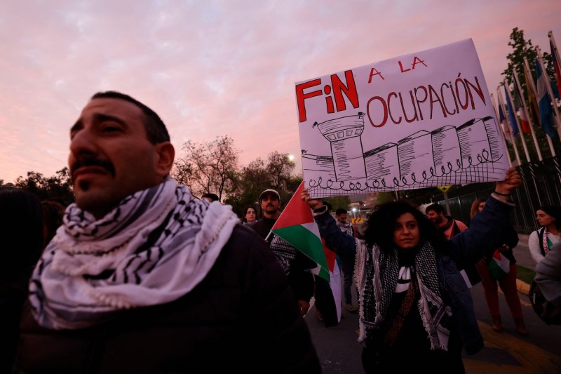 People take part in a rally to show their support for Palestinians and opposition to Israel’s military operations in Gaza in Santiago, Chile, on Oct. 10.