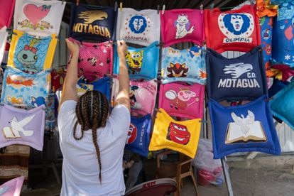 Incarcerated women sell cushions outside the National Women's Penitentiary for Social Adaptation (PNFAS), in the region of Támara, near Tegucigalpa, Honduras