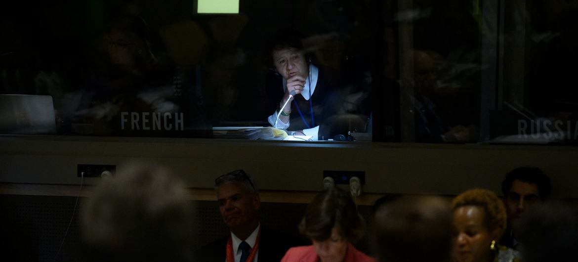 A UN interpreter works during a debate on international humanitarian law.