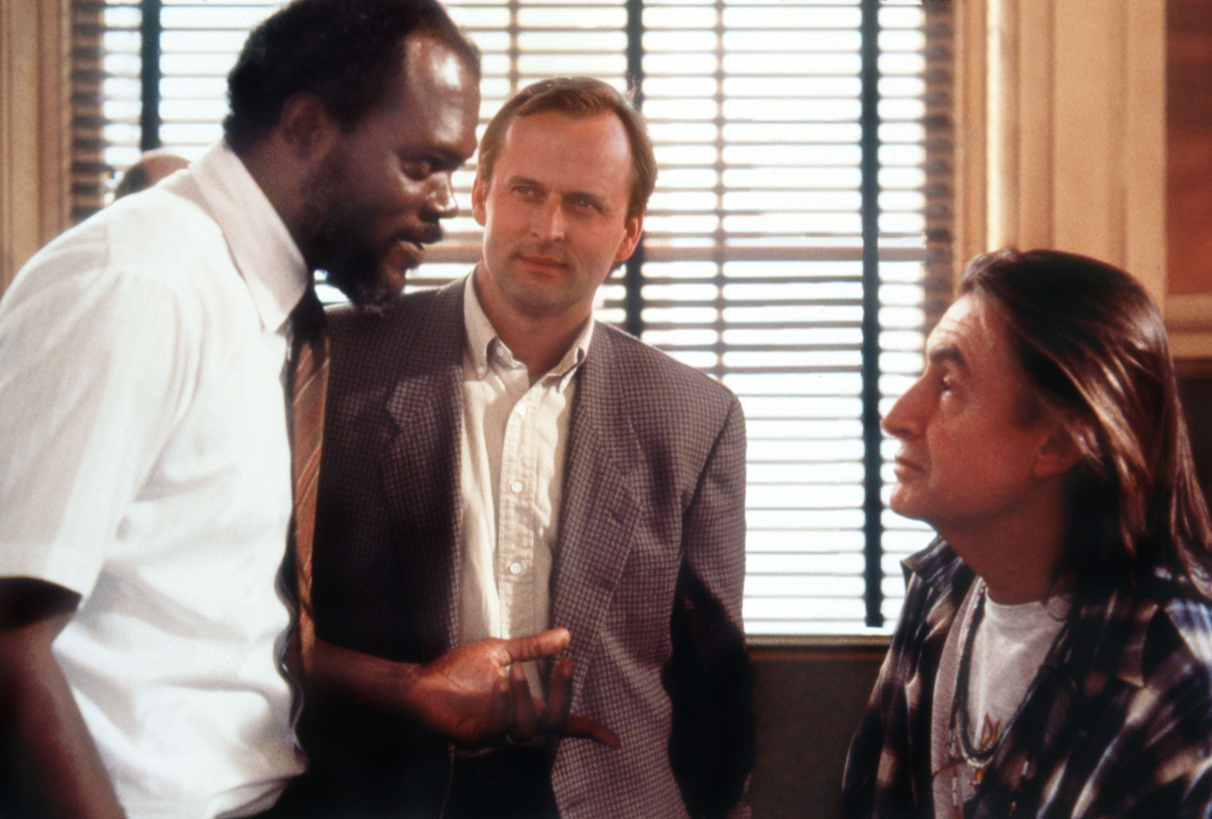 John Grisham with Samuel L. Jackson and director Joel Schumacher on the set of <i>A Time to Kill</i>. (Alamy)