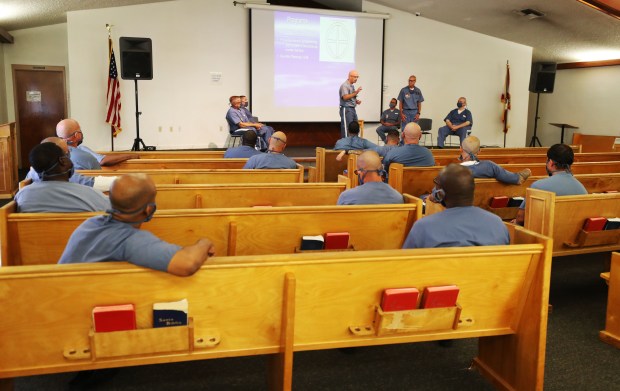 Incarcerated men hear a presentation in a chapel at the Central Florida Reception Center, a state prison facility in Orlando, on Friday, May 14, 2021. (Ricardo Ramirez Buxeda/ Orlando Sentinel)