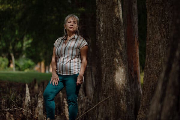 Maria Rios stands near a tree in Florida.