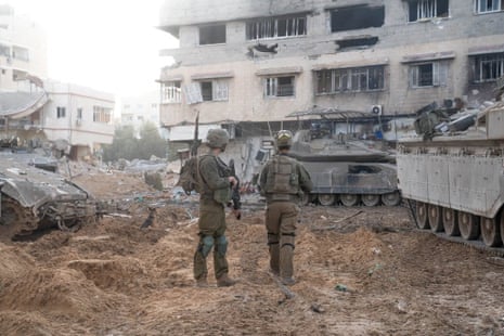 Israeli soldiers and military vehicles operate in the Gaza Strip in this handout picture released on 28 November by the Israel Defense Forces.