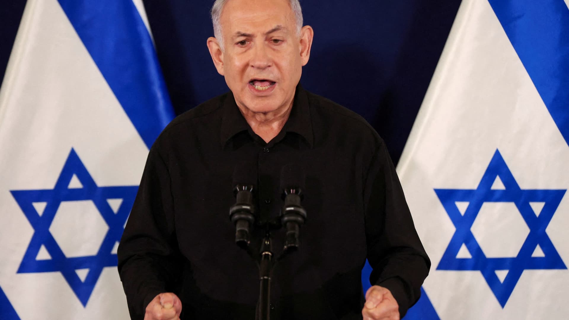 Israeli Prime Minister Benjamin Netanyahu holds a press conference with Defense Minister Yoav Gallant and Cabinet Minister Benny Gantz (not pictured) in the Kirya military base in Tel Aviv , Israel , 28 October2023. 