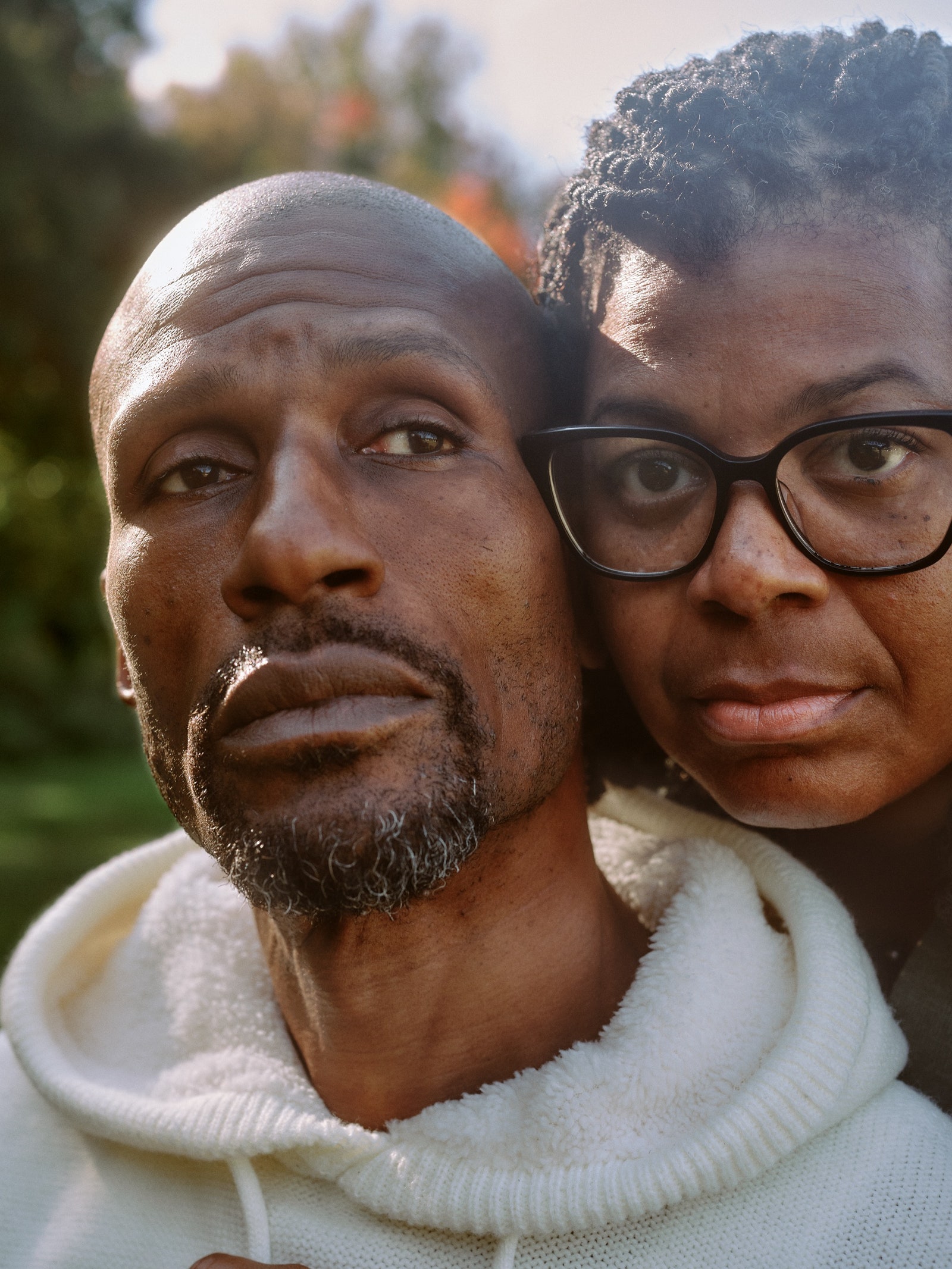 Alonzo Sawyer and his wife Carronne Jones poste with their faces close together.