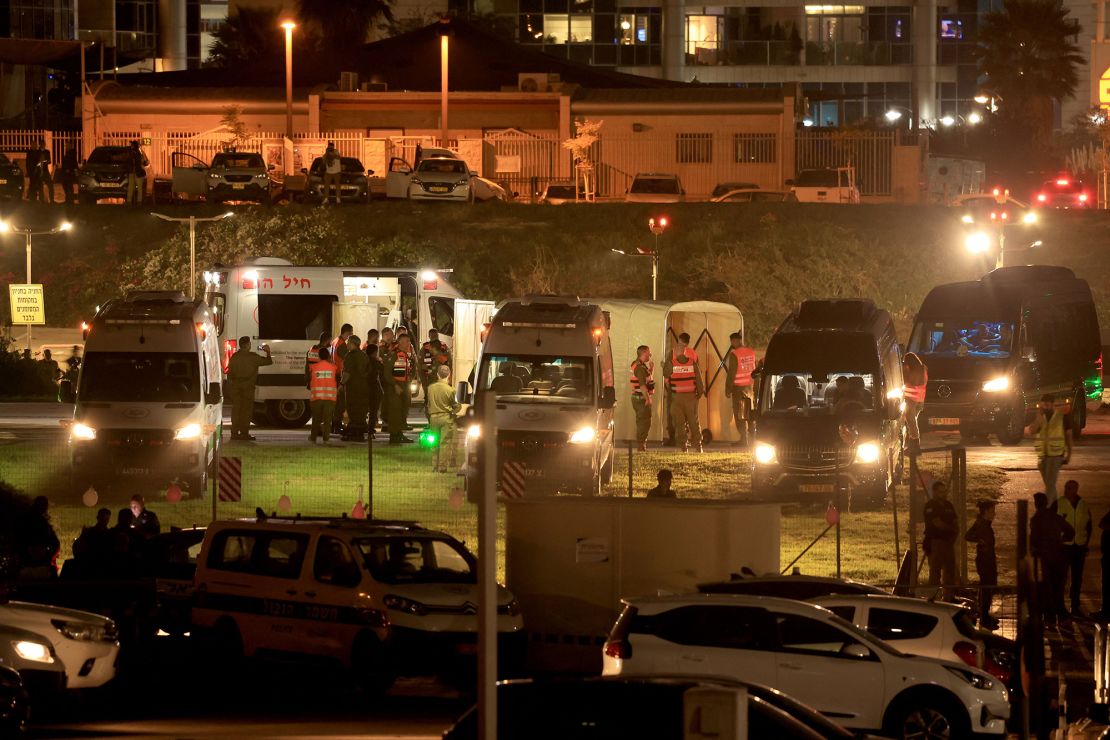 Israeli security forces stand next to ambulances waiting outside the helipad of Tel Aviv's Schneider medical centre on November 24, 2023, amid preparations for the release of Israeli hostages held by Hamas in Gaza in exchange for Palestinian prisoners later in the day. After 48 days of gunfire and bombardment that claimed thousands of lives, a four-day truce in the Israel-Hamas war began on November 24 with 50 hostages set to be released in exchange for 150 Palestinian prisoners. (Photo by FADEL SENNA / AFP) (Photo by FADEL SENNA/AFP via Getty Images)