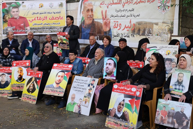 Relatives and supporters of Palestinians held in Israeli prisons stage a sit-in in front of the Red Cross in the West Bank city of Ramallah