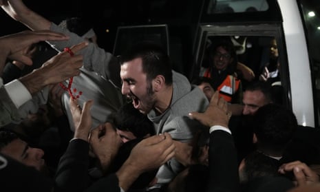 Released Palestinian prisoners arrive in the West Bank town of Ramallah on Tuesday.