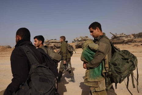 Israeli soldiers gather near the border with the Gaza Strip in southern Israel on 26 November.