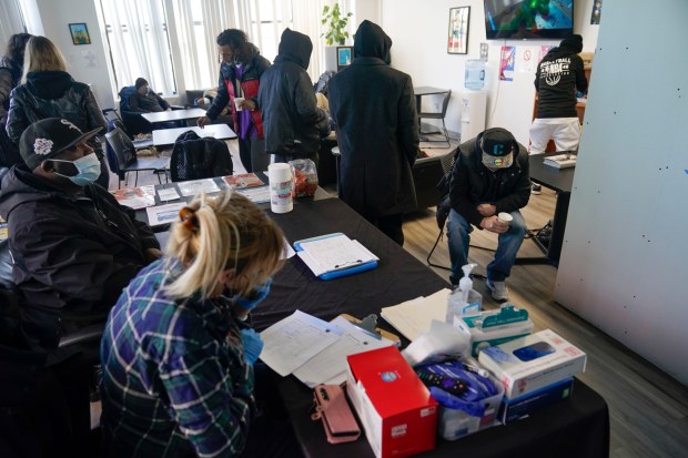 People rest and take advantage of services at the overdose prevention center at OnPoint NYC in New York, N.Y., Friday, Feb. 18, 2022. Also known as a safe injection site, the privately run center is equipped and staffed to reverse overdoses, a bold and controversial contested response to confront opioid overdose deaths nationwide. (AP Photo/Seth Wenig)