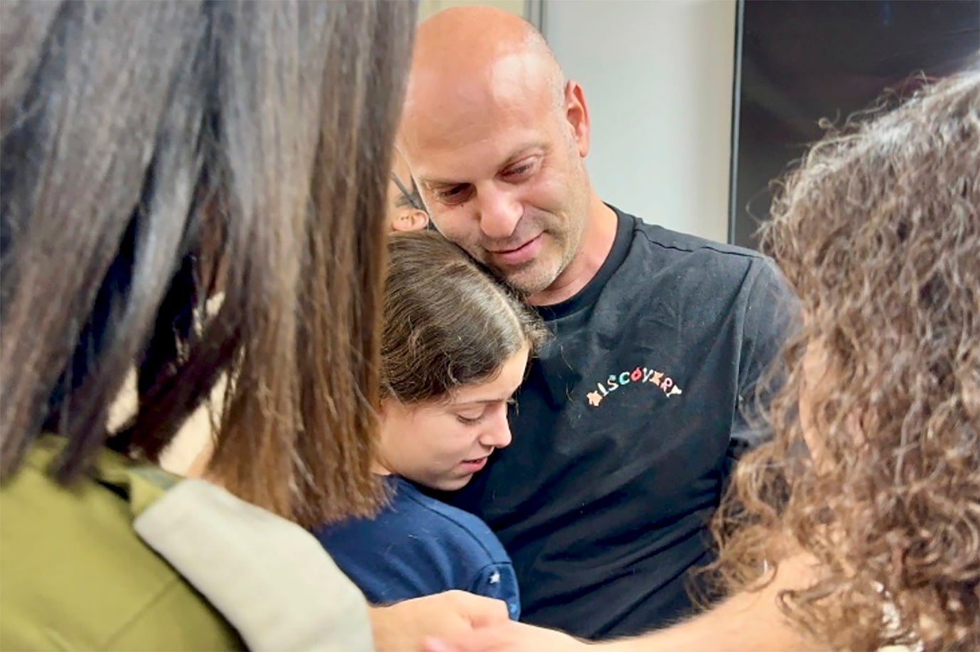 <p>In this photo provided by the Israeli Army, Hila Rotem Shoshani, a released hostage, reunites with her uncle on Sunday</p>