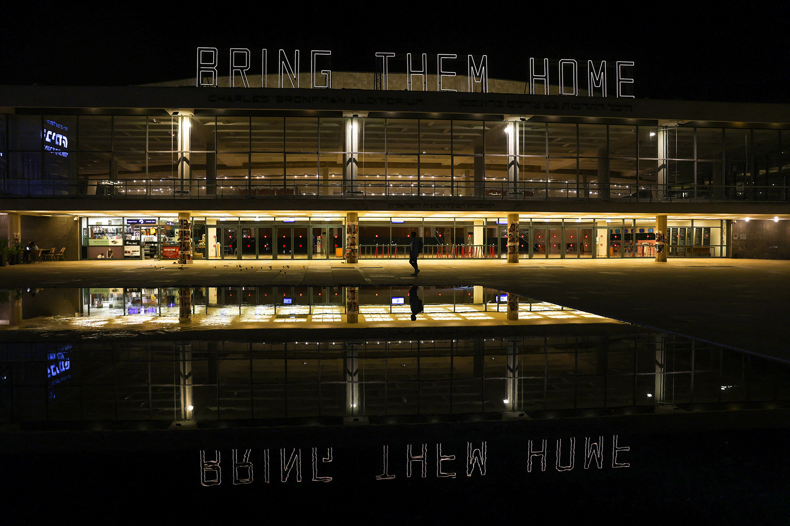 A sign illuminates a square calling for the release of Israelis being held in Gaza on November 21, in Tel Aviv.