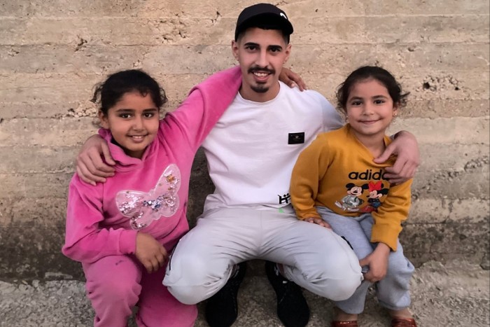 Mohammed Darwish, centre, with his two younger sisters in the village of Beit Ur al-Tahta, West Bank on November 26 2023