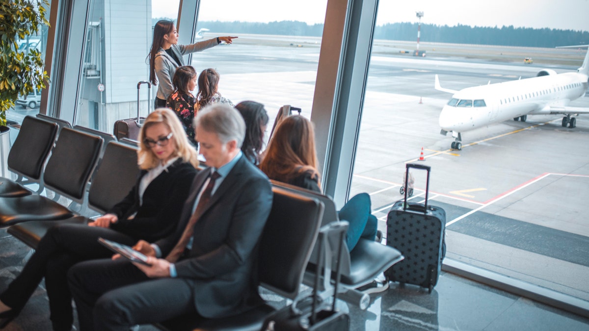 people waiting in airport