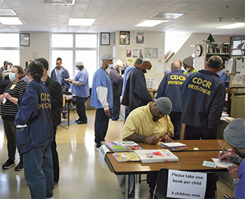 San Quentin Prison residents select books to send to the children in their lives.