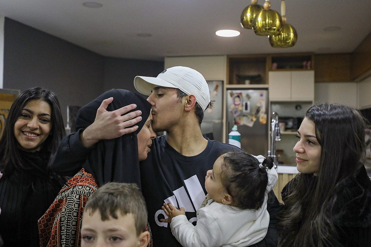 Freed Palestinian convict Mohammed Al-Awar arrives to his home in Silwan, East Jerusalem, after being released as part of a deal between Israel and Hamas, November 26, 2023. (Jamal Awad/Flash90)