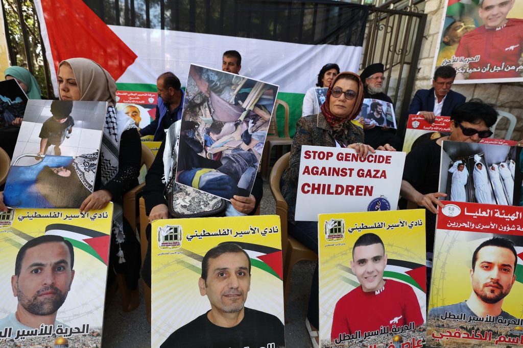 Families of Palestinian prisoners stage a sit-in in front of the Red Cross offices in the West Bank city of Ramallah on October 17, 2023, demanding the release of their children from Israeli prisons. (Jaafar Ashtiyeh—AFP/Getty Images)